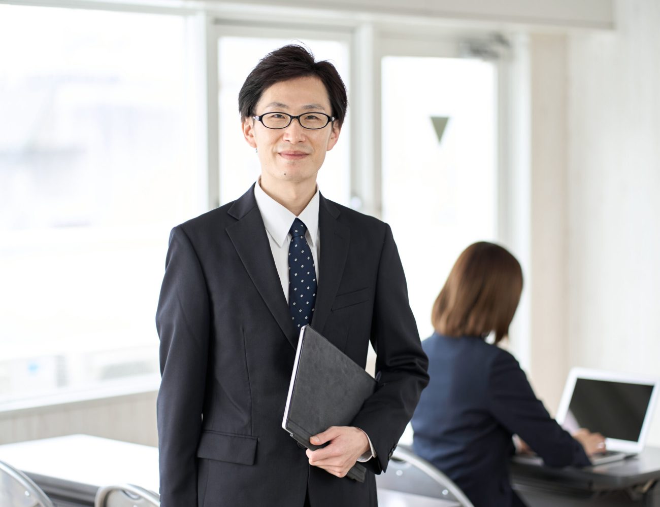 asian-businessman-with-tablet-in-seminar-room-2025-03-13-15-11-52-utc